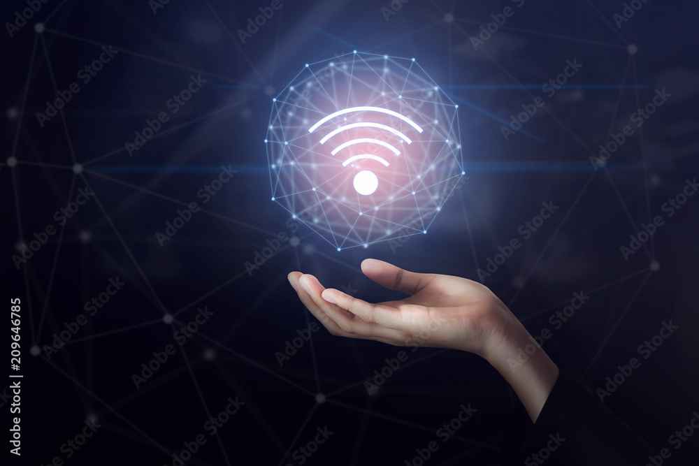 Hand holding wifi network connection icon. Innovation technology concept. Hand holding wifi network connection icon. Innovation technology concept.