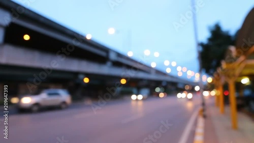 Lights on street in midnigh, Night traffic of big city road view with construction site, blurred defocused busy heavy driving scene in rush hour, cityscape of megapolis with headlights beams. photo