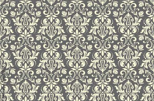 Wallpaper in the style of Baroque. A seamless vector background. Grey floral ornament. Graphic pattern for fabric, wallpaper, packaging. Ornate Damask flower ornament