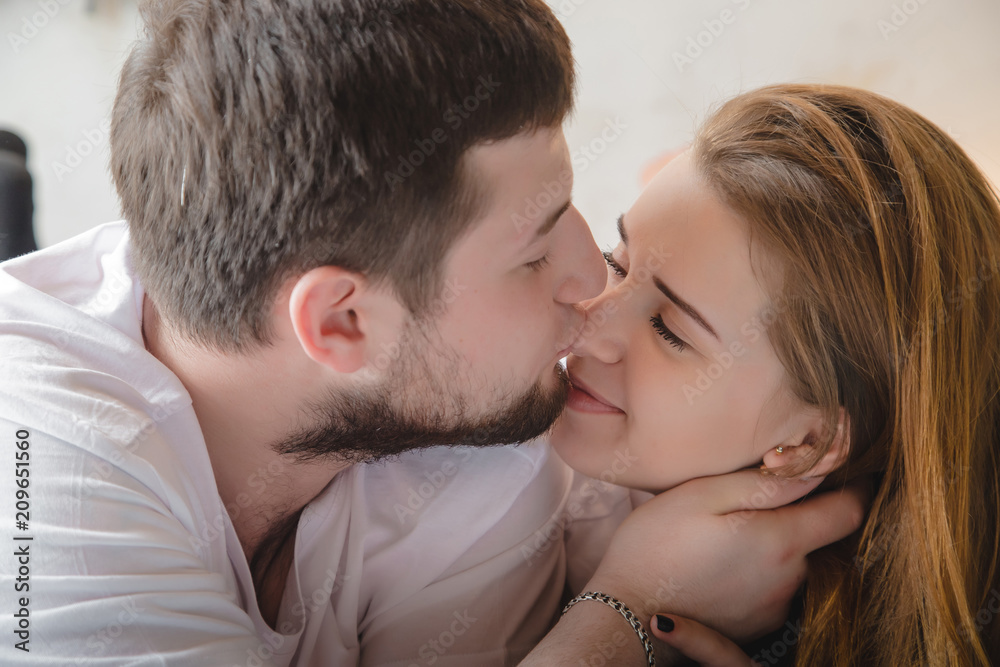 Lovely couple have fun, rest and relax on the bed together Lovely couple have fun, rest and relax on the bed together