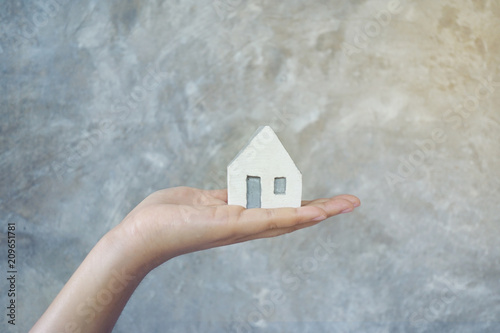 House in hand close-up.on bright background