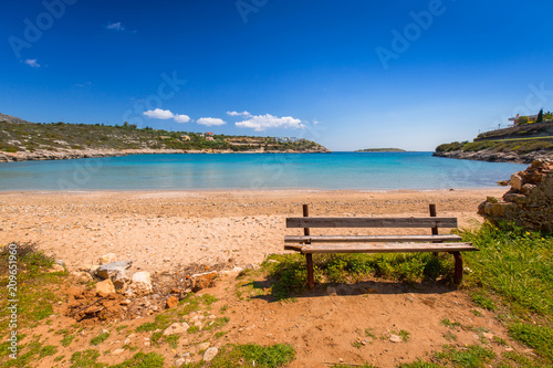 Empty bench at Marathi bay beach on Crete, Greece