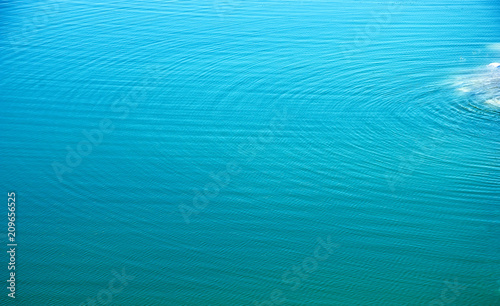 Beautiful turquoise water texture with small waves, Watery Background