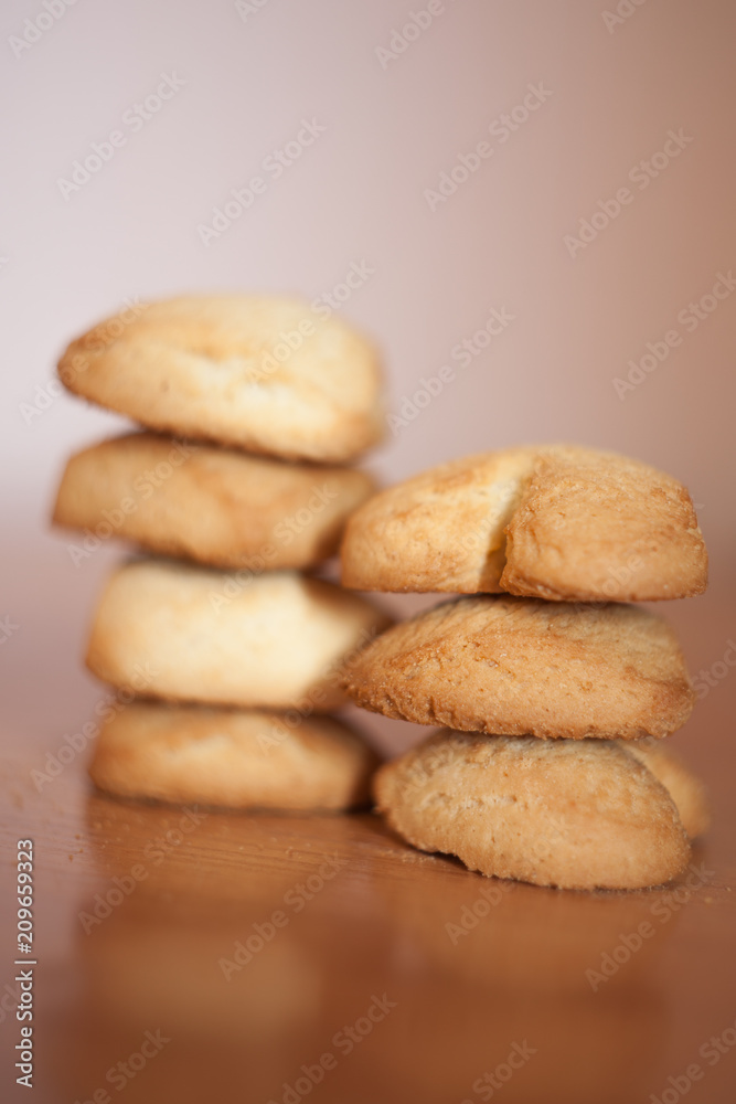 Stack of chocolate chip cookies on wooden board with Home Baked Oat Cookies Stack of chocolate chip cookies on wooden board with Home Baked Oat Cookies