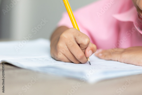 Close up a little girl doing homework