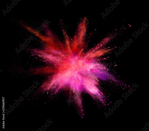 Explosion of coloured powder isolated on black background. Abstract background in high resolution.