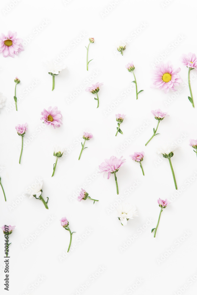 Obraz premium Floral pattern with tender pink and white flowers arranged as a flatlay on white background