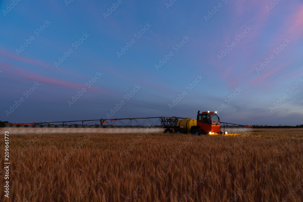 Machine for spraying pesticides and herbicides in the field at work Machine for spraying pesticides and herbicides in the field at work
