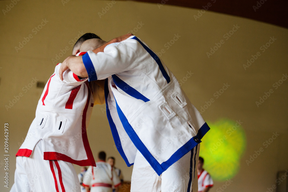 Fototapeta premium Fight of two athletes Asian Kuresh fight on the mat