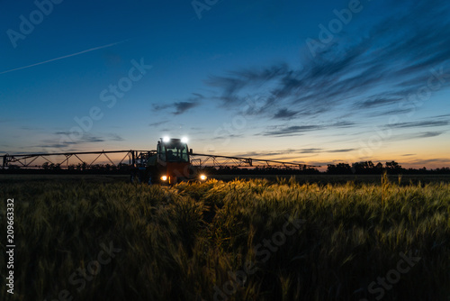 Machine for spraying pesticides and herbicides in the field at night. 