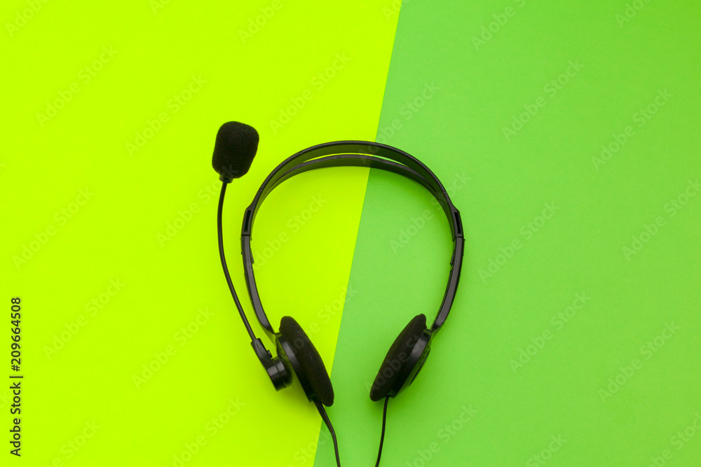 audio headset on color background