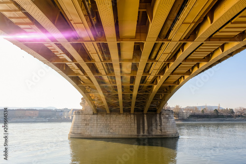 rays of the sun under the bridge in Budapest