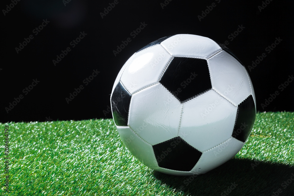 Closeup of ball on the green grass.