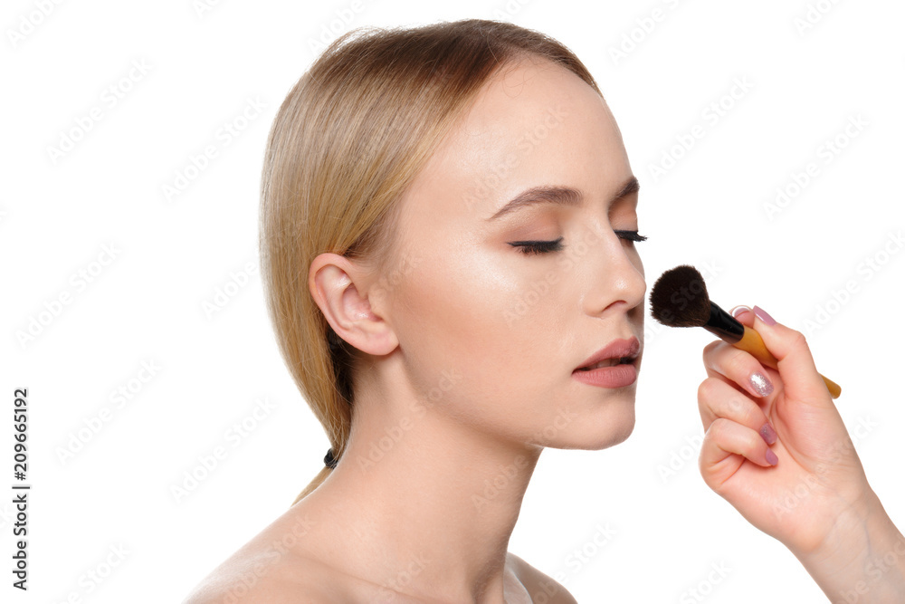 Beauty portrait of a smiling beautiful half naked woman posing with make-up brushes Beauty portrait of a smiling beautiful half naked woman posing with make-up brushes
