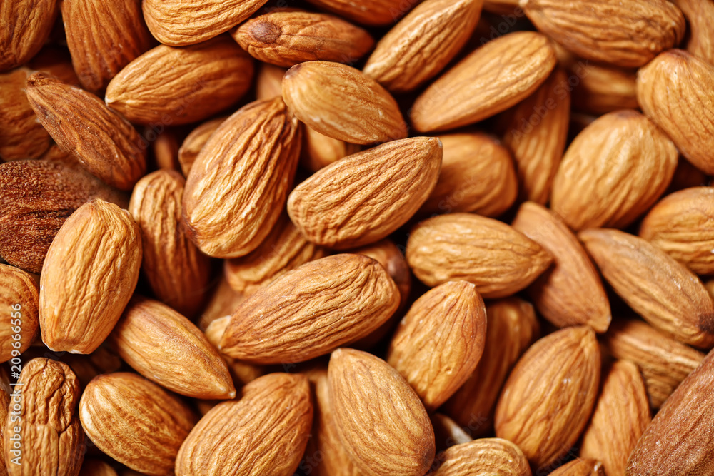 Almond on a wooden table in the summer garden. Useful food. Healthy lifestyle. Almond on a wooden table in the summer garden. Useful food. Healthy lifestyle.