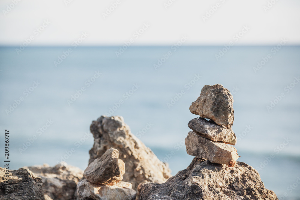 Pyramid of stones, image with retro toning, relaxation, freedom and nature concept