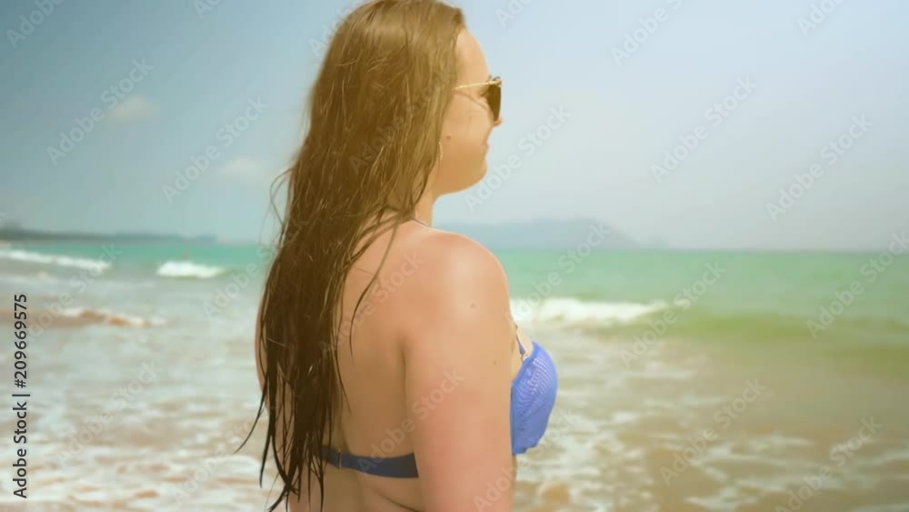 Young Girl Goes to the Sea. Medium Shot. Colorful. Slow Motion Young Girl Goes to the Sea. Medium Shot. Colorful. Slow Motion