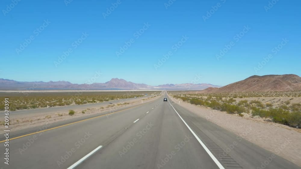 Shot From The Car Movement On A Highway In The Desert On The Road To Las Vegas Shot From The Car Movement On A Highway In The Desert On The Road To Las Vegas