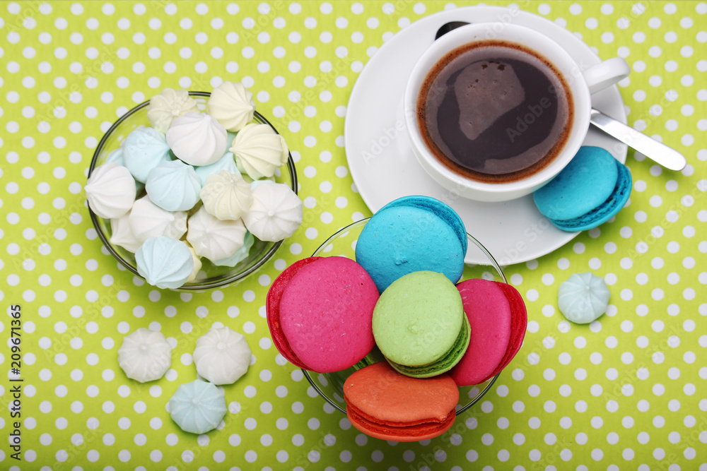 A cup of coffee and macaroons ready for breakfast A cup of coffee and macaroons ready for breakfast