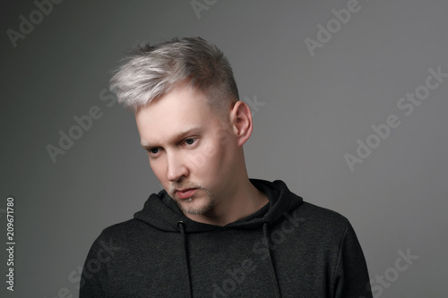 Young man portrait on white background. Gray hair, color, gray, beard. Blond. Everyday clothes, sweetshot, student, businessman.