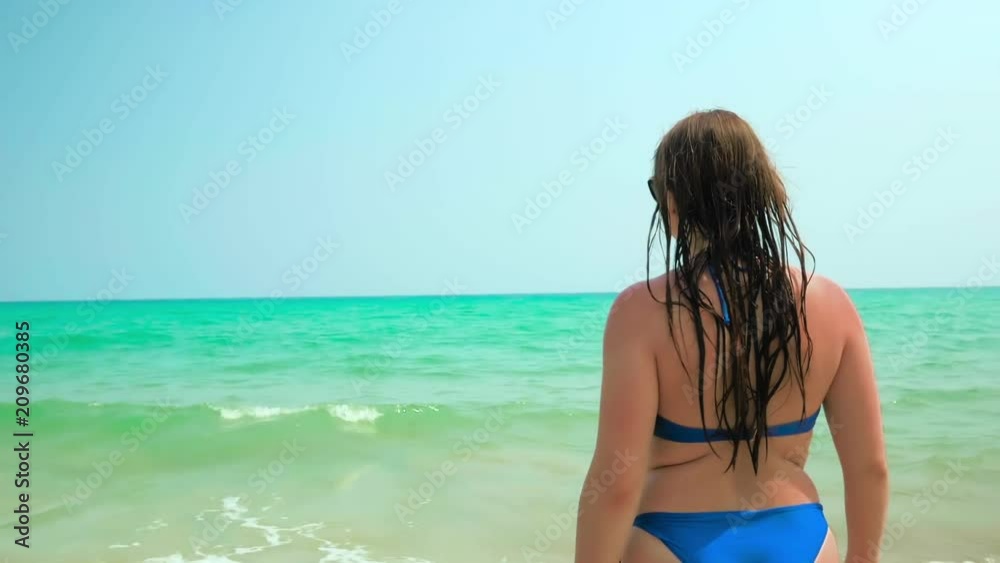 Young Girl Goes to the Sea. Medium Shot. Colorful. Slow Motion Young Girl Goes to the Sea. Medium Shot. Colorful. Slow Motion