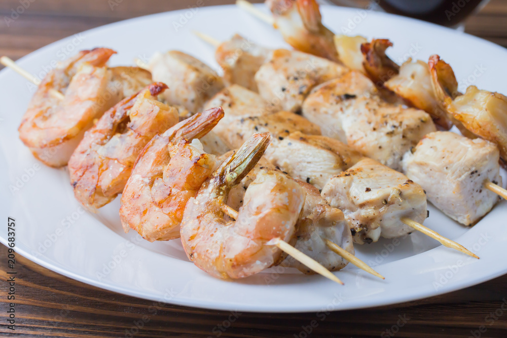 fried shrimp and chicken with teriyaki sauce on a plate