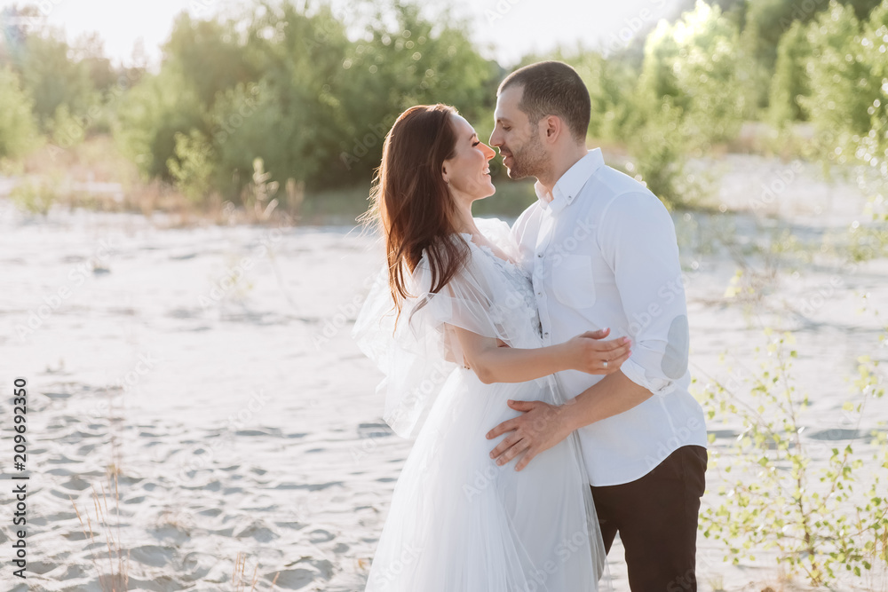 beautiful smiling couple hugging on beach beautiful smiling couple hugging on beach