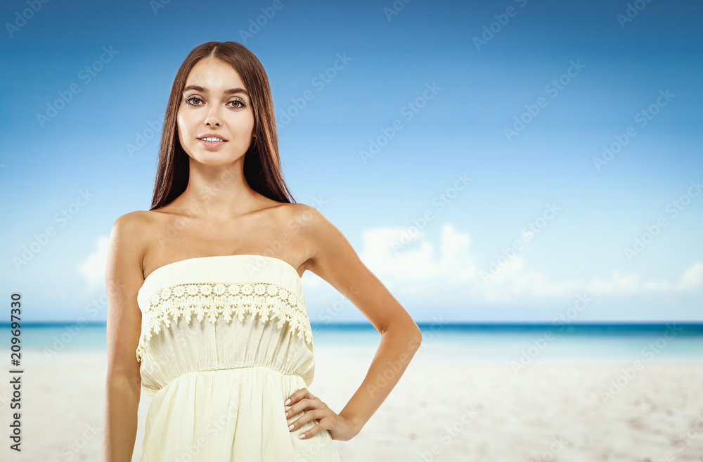 Beautiful young woman on the beach. Blurry beach and ocean background. Beautiful young woman on the beach. Blurry beach and ocean background.