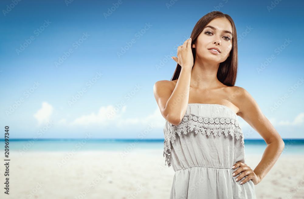 Beautiful young woman on the beach. Blurry beach and ocean background. Beautiful young woman on the beach. Blurry beach and ocean background.