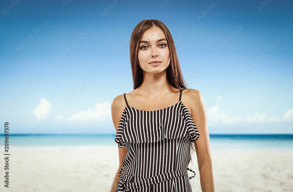 Beautiful young woman on the beach. Blurry beach and ocean background. Beautiful young woman on the beach. Blurry beach and ocean background.