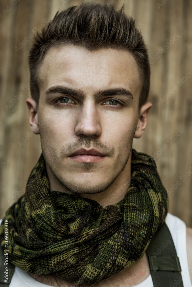 Fototapeta premium Close-up portrait of young male military soldier 