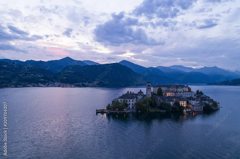 View of San Giulio island at evening, Orta lake, Italy. Aerial view.