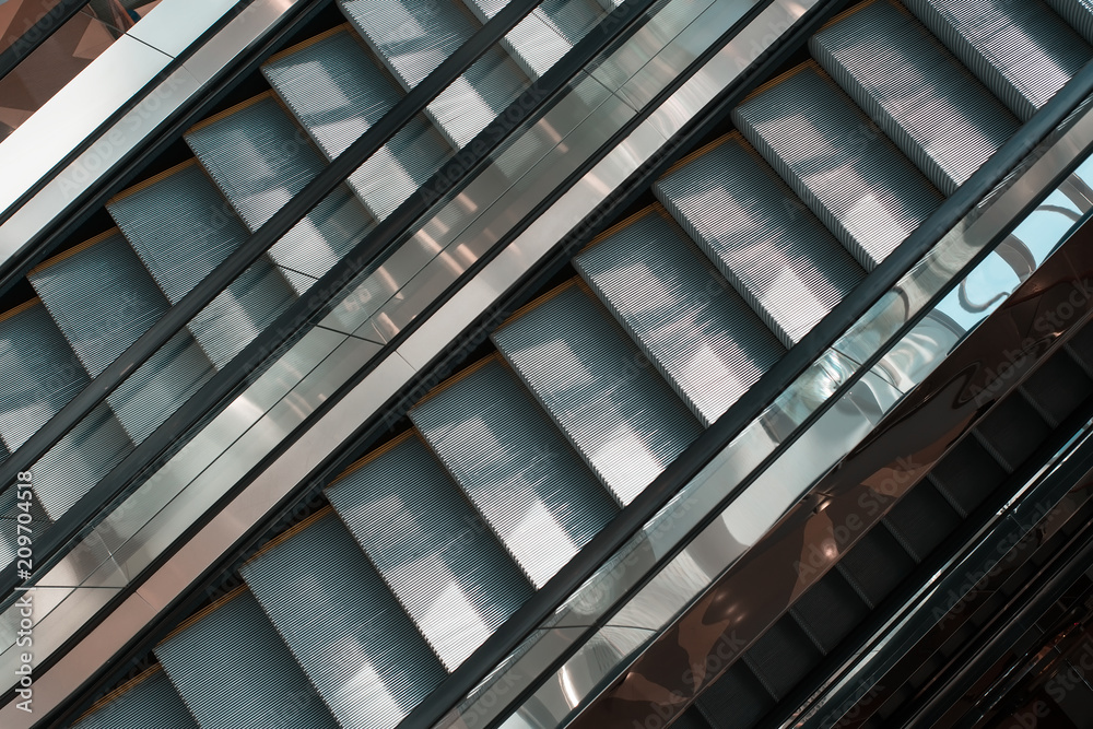 Escalator in the building. Escalator in the building.