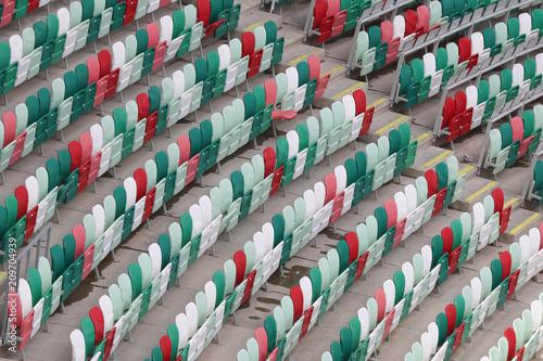 Multi-colored seats for fans at the stadium