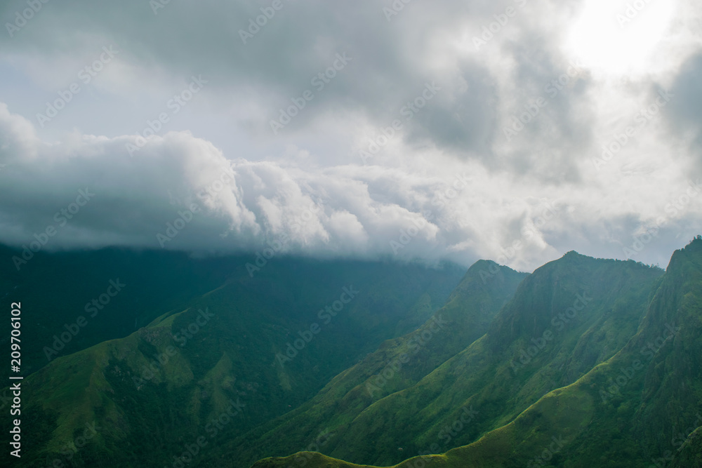Clouds moving over a mountain