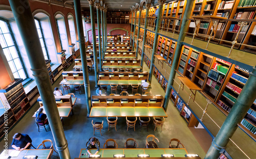 Photography Top view on tables with reading and stading people in National Library of Sweden