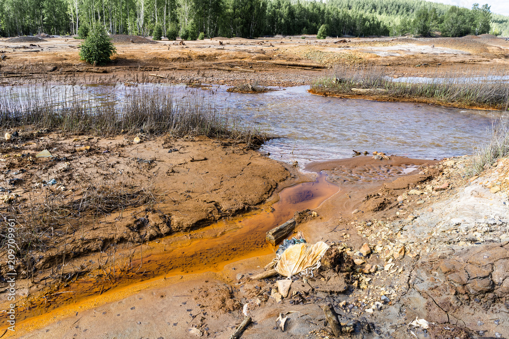 Experts analyze the water in a contaminated environment. Experts analyze the water in a contaminated environment.