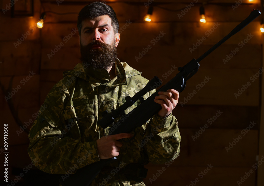 beard wears camouflage clothing 