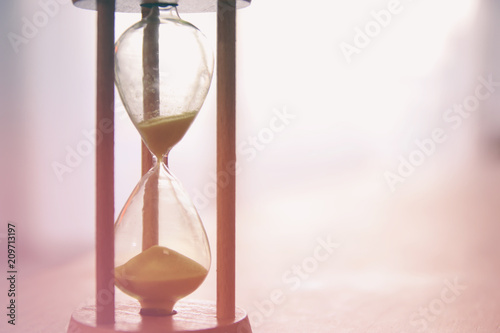 Hourglass as time passing concept for business deadline.