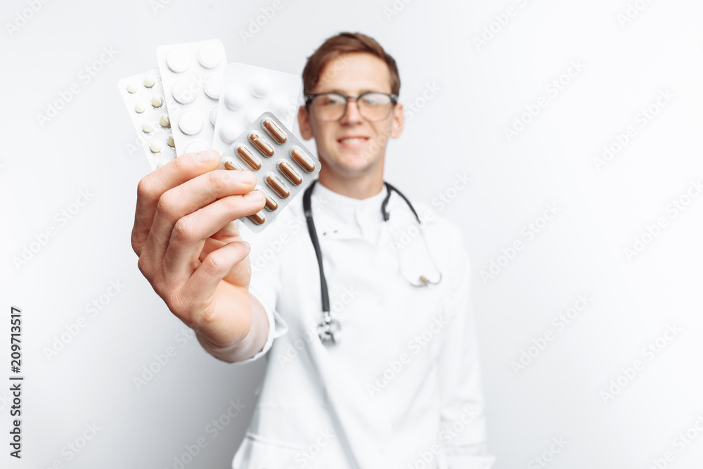 Hand doctor holding tablet, close-up, white background, for advertising, text insertion Hand doctor holding tablet, close-up, white background, for advertising, text insertion