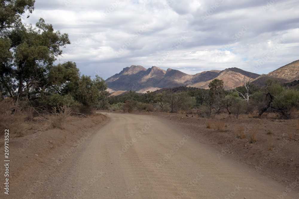 Naklejka premium Moralana Scenic Drive South Australia, scene from dirt road in the flinders ranges on an overcast day