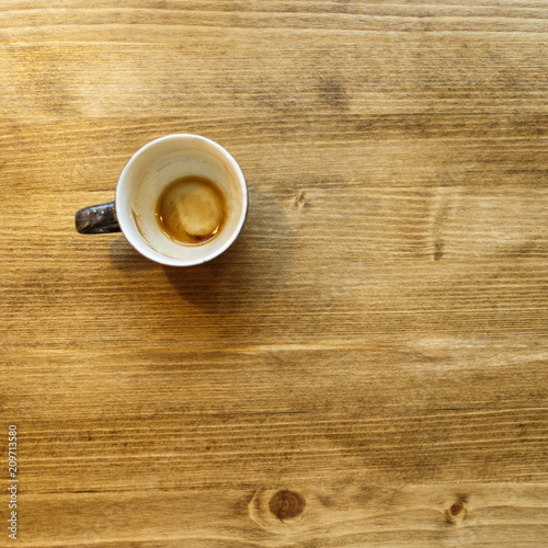 Empty coffee cut at the wooden table