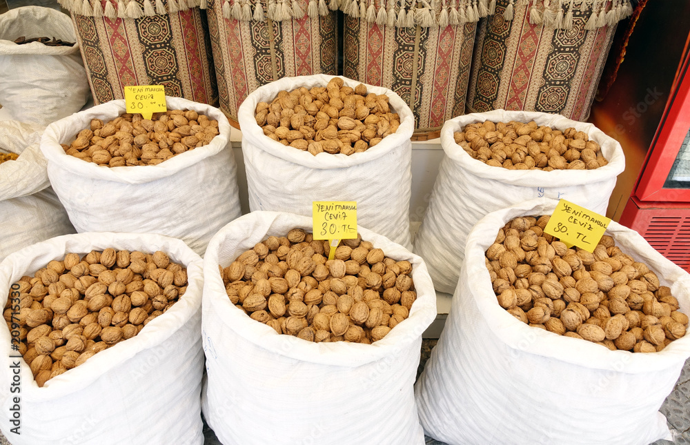 Walnuts in a white bag at the market. Walnuts in a white bag at the market.