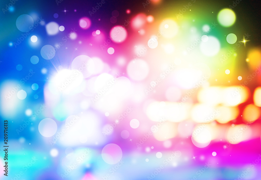 Colorful glitter sparkles rays lights bokeh Festive Elegant abstract background.