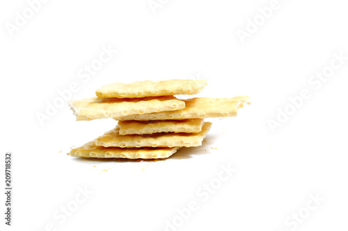 stack of yellow crakers on white background isolated