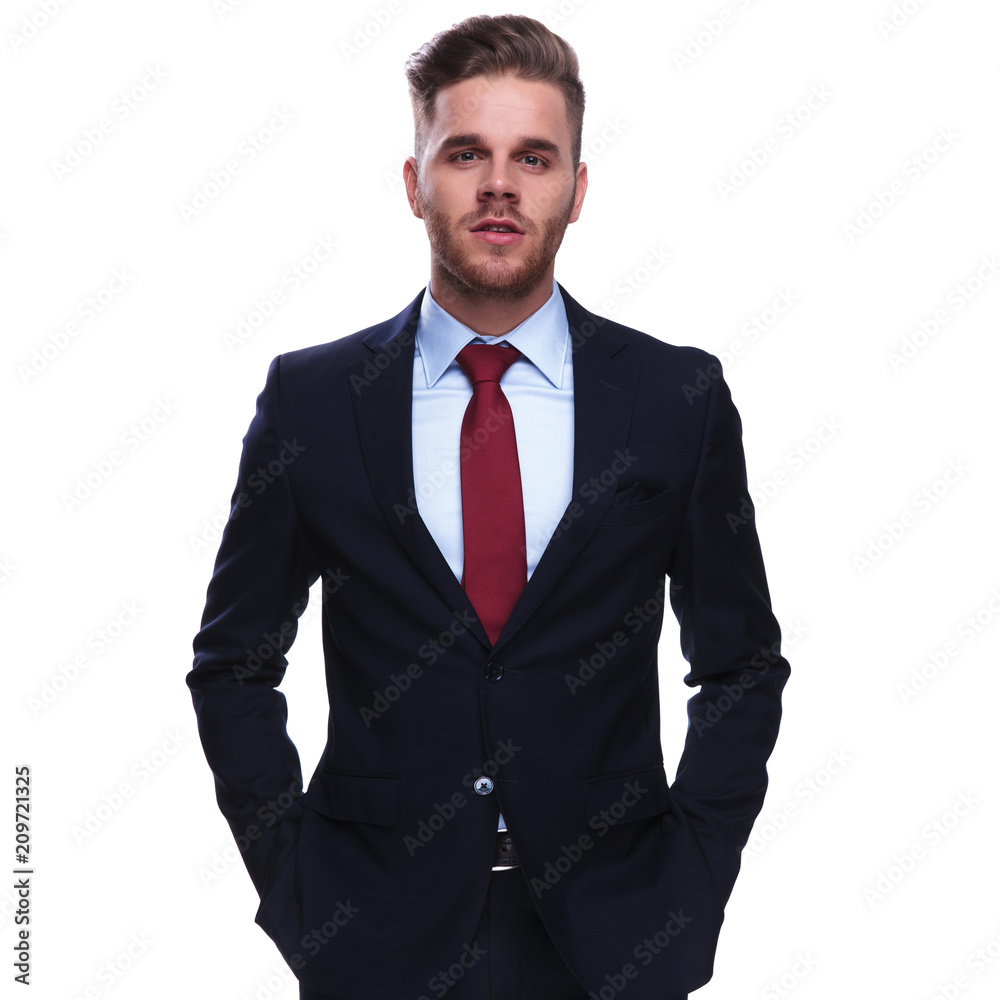 portrait of elegant attractive businessman with hands in pockets portrait of elegant attractive businessman with hands in pockets