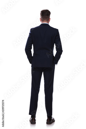 back view of relaxed businessman in navy suit standing © Viorel Sima