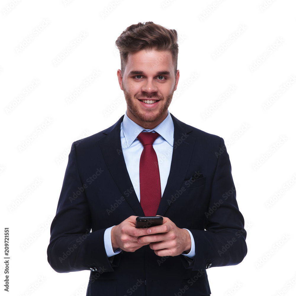 portrait of handsome businessman checking his mobile phone portrait of handsome businessman checking his mobile phone