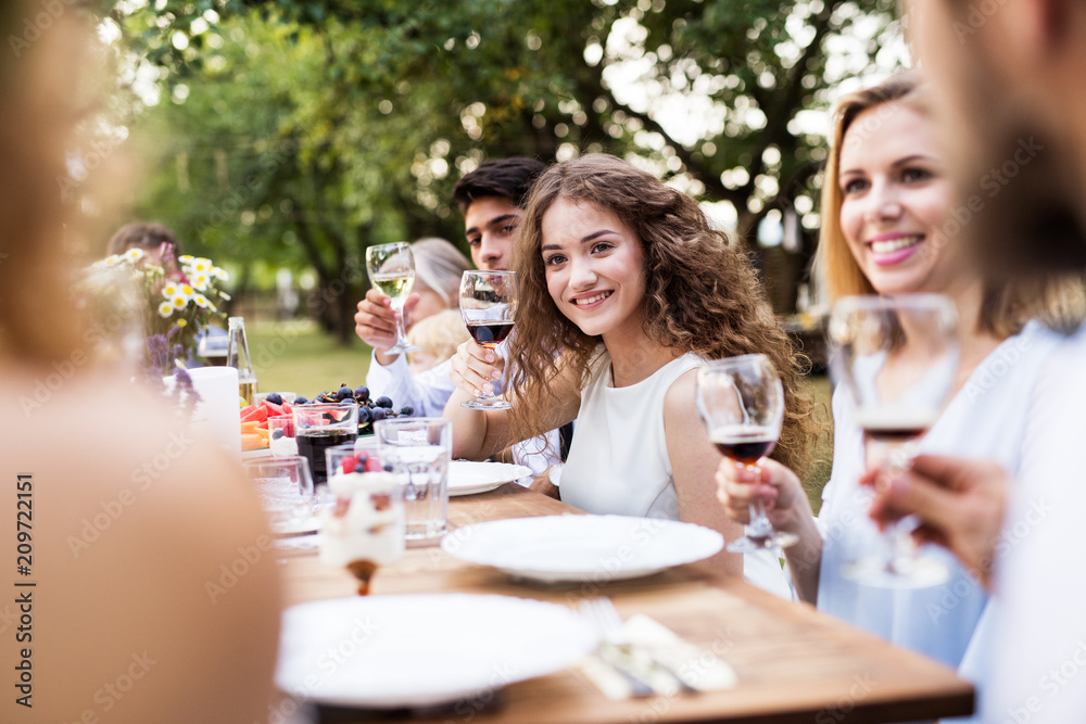 Family celebration or a garden party outside in the backyard. Family celebration or a garden party outside in the backyard.