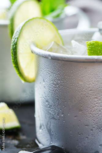 Photography Moscow mule cocktail with vodka, ginger beer, lime and mint